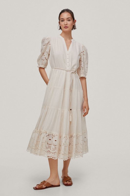 Long dress with floral openwork fabric at the sleeves and hem.