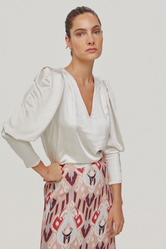 Satin blouse with voluminous sleeves.