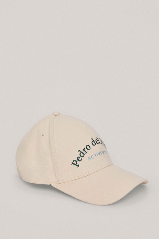Canvas cap with embroidered logo